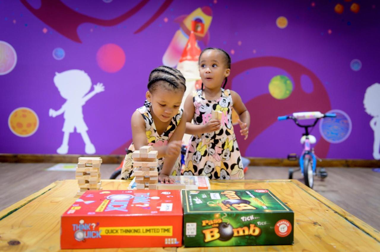The Capital Zimbali Ballito Exterior foto Two children playing with board games
